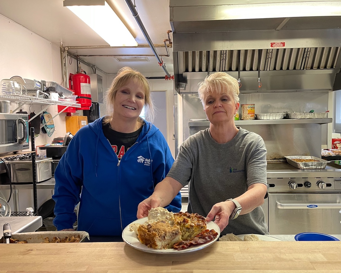 Angie and Tiffany cook meals monthly at the Columbus Rescue Mission.